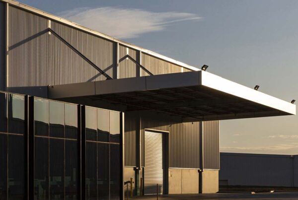 Vacant Building Insurance - New Commercial Property Building for Small Warehouse Sitting Vacant on a Sunny Day at Dusk